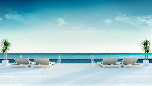 Photo summer beach lounge sun loungers on sunbathing deck and private swimming pool  at luxury villa