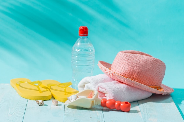 Summer beach vacation and accessories on blue background