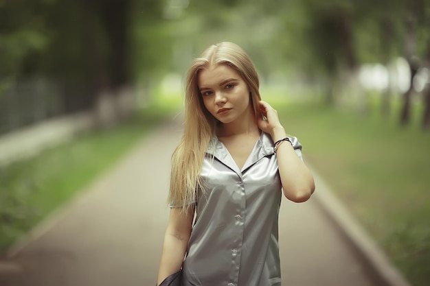 Summer beautiful young blonde in the park