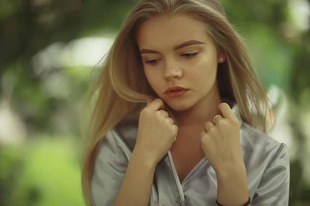 Summer beautiful young blonde in the park