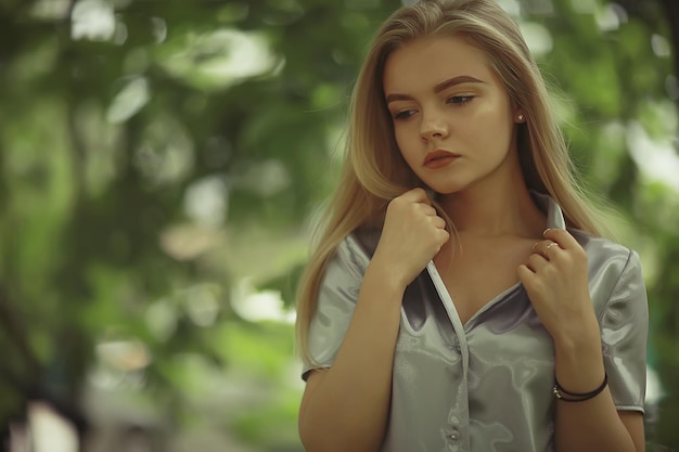 Summer beautiful young blonde in the park