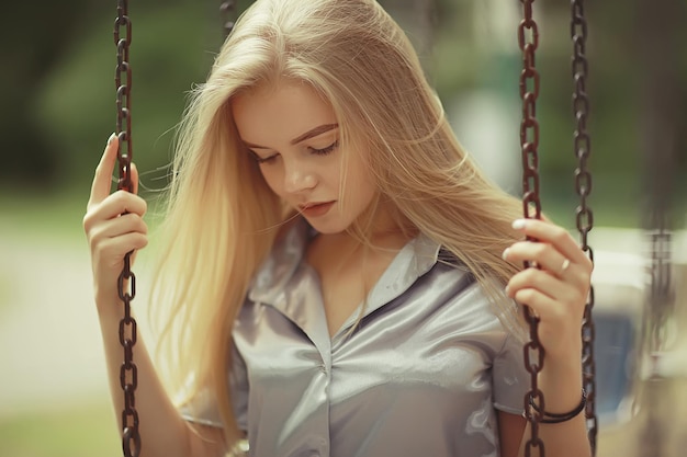 Summer beautiful young blonde in the park