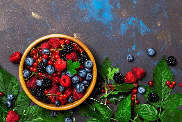 Summer berries in assortment food background top view copy space