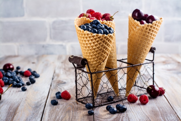 Summer berries in waffle cones