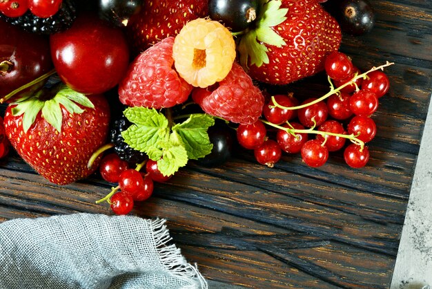 Summer berries on a wooden board close-up