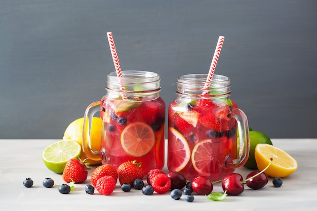 Summer berry lemonade with lime and mint in mason jar