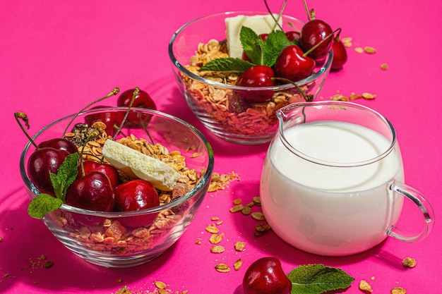 Summer breakfast concept healthy morning food ripe cherries milk white chocolate and granola