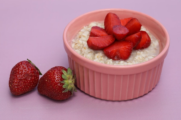 summer breakfast with oatmeal and fresh strawberry