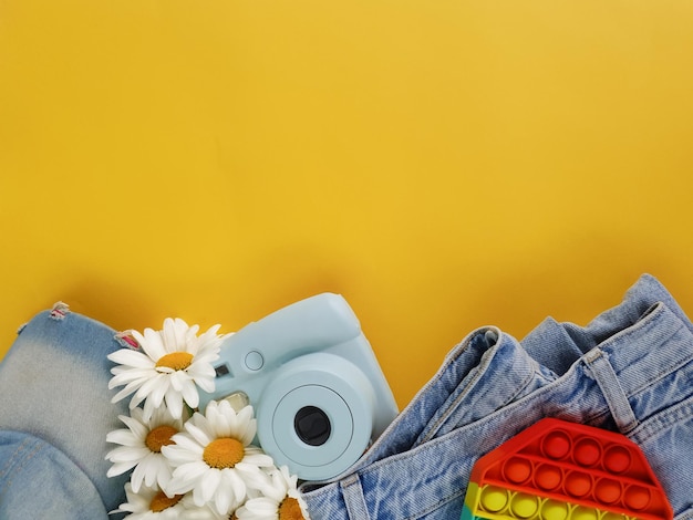 Summer bright flatlay on a yellow background