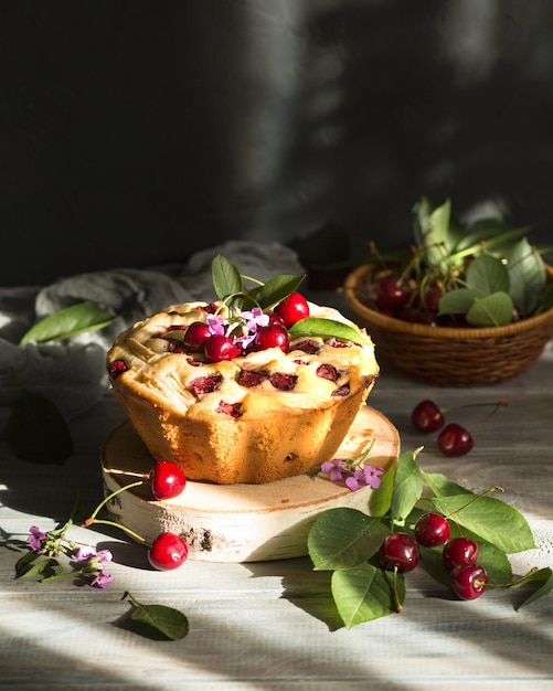 Summer cake with cherries on a wooden table Homemade tea party Sweet dessert