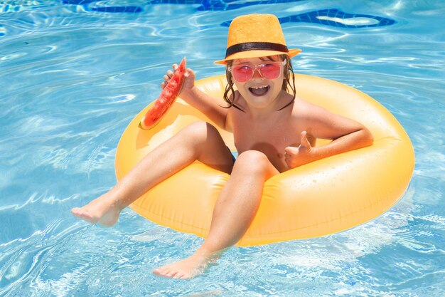 Summer child face child in swimming pool summer kids activity summer vacation healthy kids lifestyle