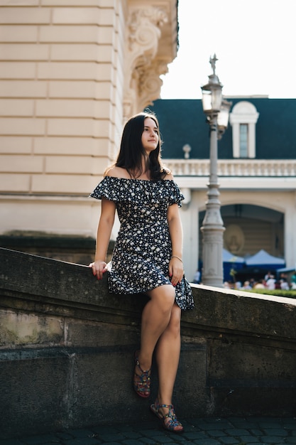 Summer city. Young woman in summer city