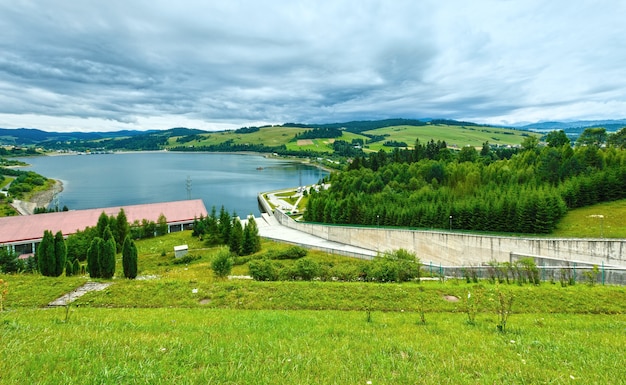 Summer cloudy country view and lake Czorsztyn, Poland.