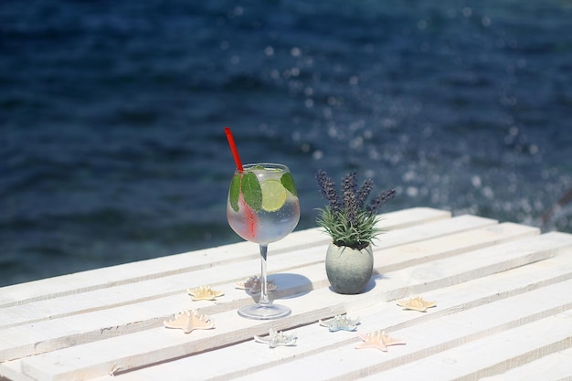 Summer cocktail on the background of the sea Summer vacation relaxation summer party