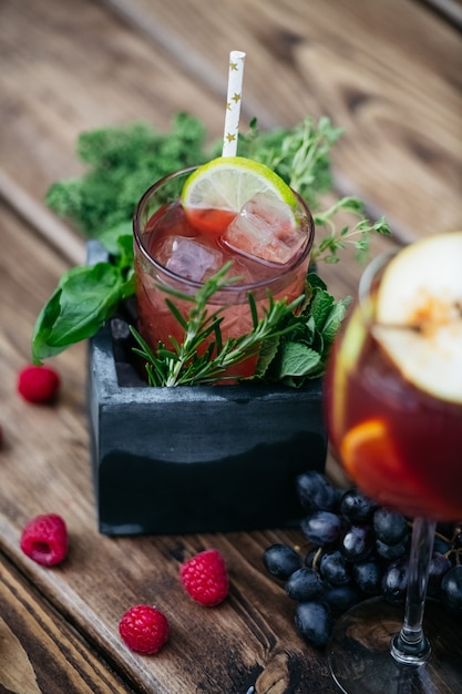 Summer cocktail with fruits in stone box