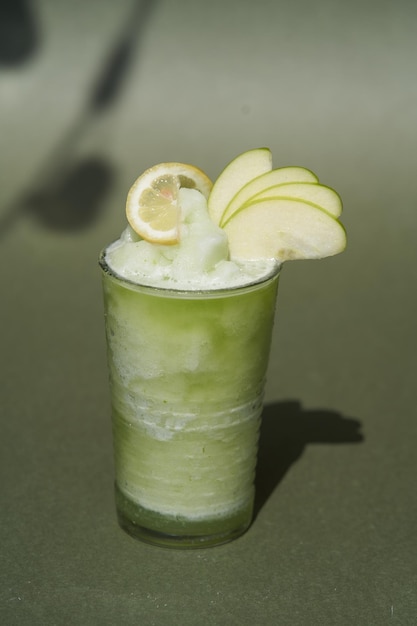 Summer cocktail with green apple and ice