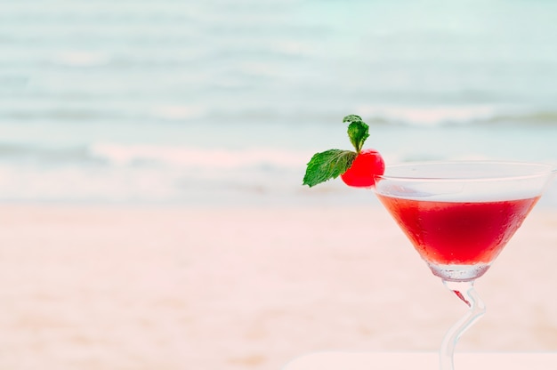 Summer cocktail with tropical beach