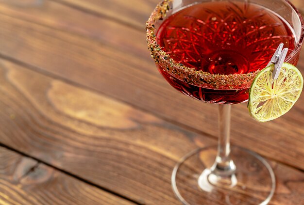 Summer cocktail on a wooden table