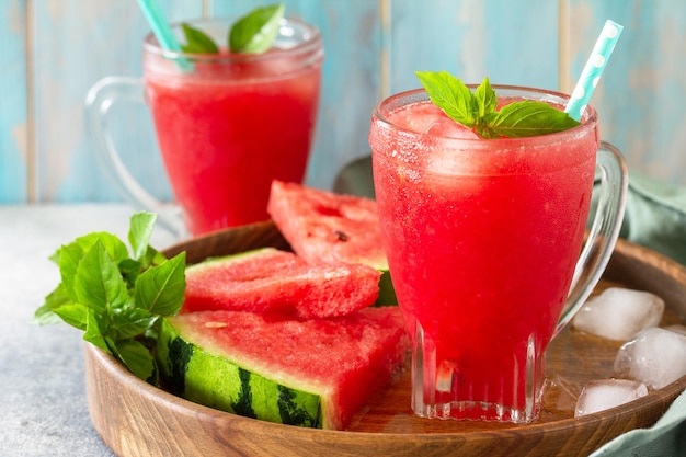 Summer cold drink Refreshing Watermelon drink in glasses and slices of watermelon