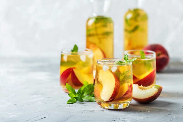 Summer cold tea with peaches and mint