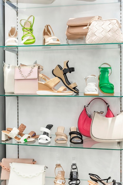 Summer collection of women's shoes and accessories on display in the store Style elegance and fashion Vertical