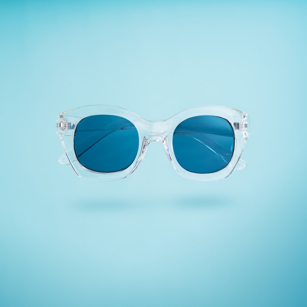 Summer creative concept. Minimal style with transparent sunglasses