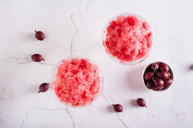 Summer drink frozen wine slushy in glasses on the table Refreshing alcoholic cocktail Top view