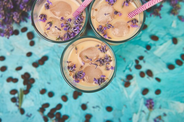 Summer drink iced coffee with lavender in glass