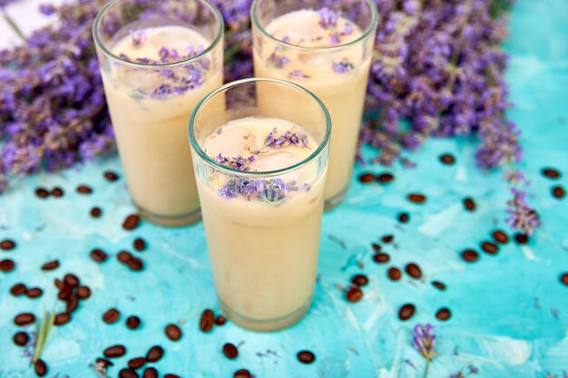 Summer drink iced coffee with lavender in glass