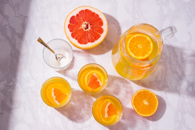 Summer drink. Orange and Grapefruit refreshing drink. Top view flat lay background.