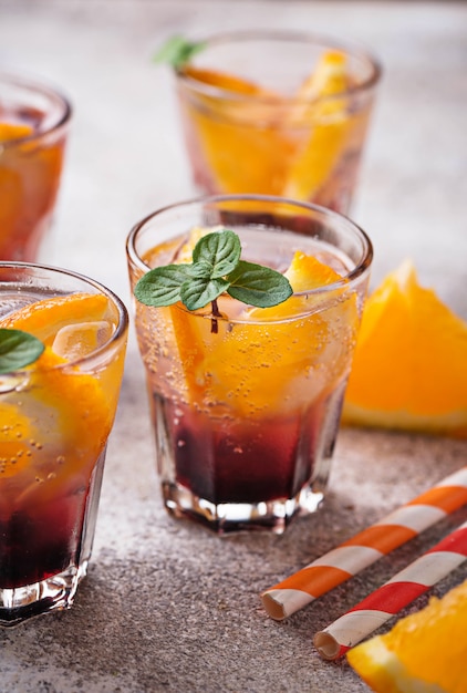 Summer drink with orange and berries