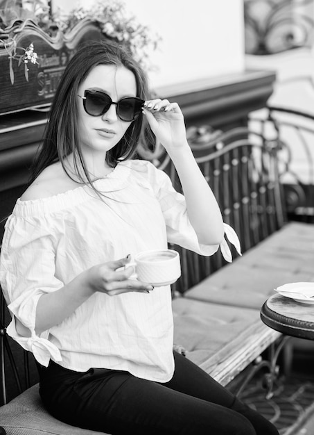 Summer fashion Starting day with good news Meeting in cafe good morning Breakfast time girl relax in cafe Business lunch stylish woman in glasses drink coffee morning coffee Waiting for date