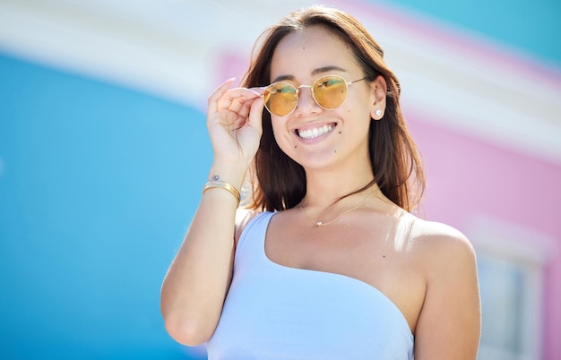 Summer fashion and sunglasses style and woman while happy in urban and cityscape Young Asian model and stylish accessories gen z travel and vacation trendy and fashionable in the street