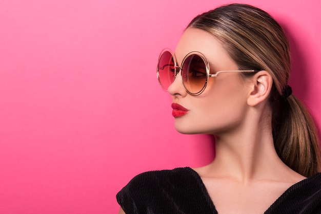 Summer fashion women accessories commercial concept. woman with colorful sunglasses.