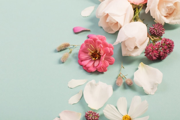 Summer flowers on green paper background