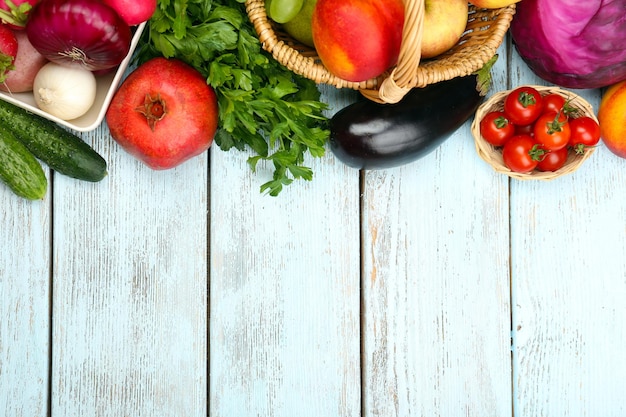 Summer frame with fresh organic vegetables and fruits on wooden background