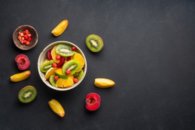 Summer fresh bowl with colorful fruit salad