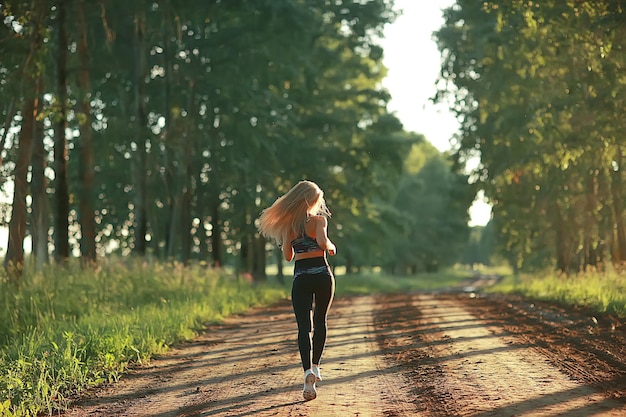 summer girl running nature / young adult athletic slender girl jogging, nature, freshness beauty summer