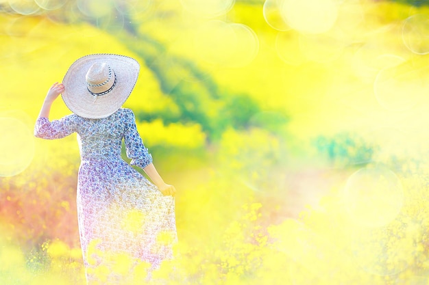 summer girl in a sunny field with flowers, warm happy sunset in nature