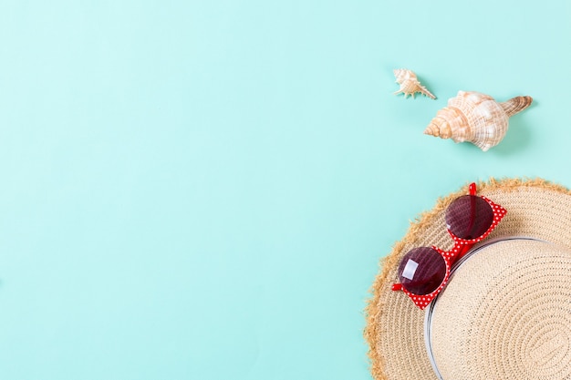 Summer holiday beach background with accessories on blue table, top view with copy space. vacation concept.