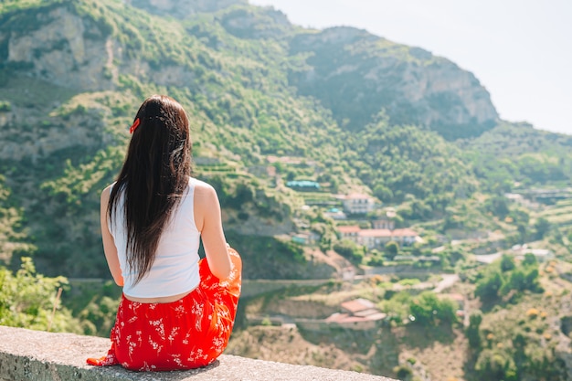 Summer holiday in Italy. Young woman in Positano village, Amalfi Coast, Italy