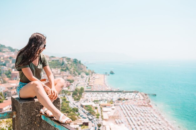 Summer holiday in Italy. Young woman in Positano village, Amalfi Coast, Italy