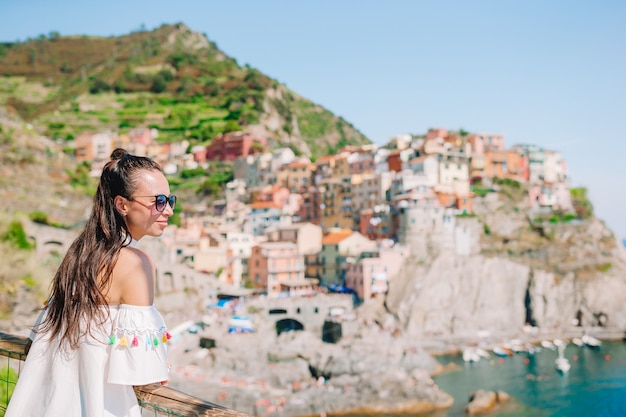 Summer holiday in Italy. Young woman in Positano village on the background, Amalfi Coast, Italy