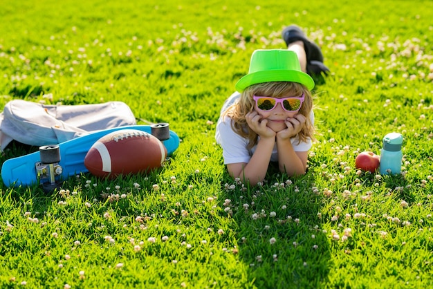 Summer holiday kid boy relax at park outdoor summer weekend summertime vacation