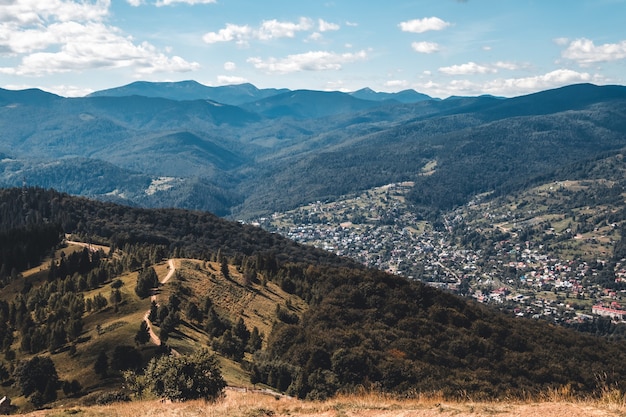 Summer landscape in mountains and the dark blue sky with clouds