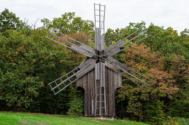 Summer landscape with an old wooden mill