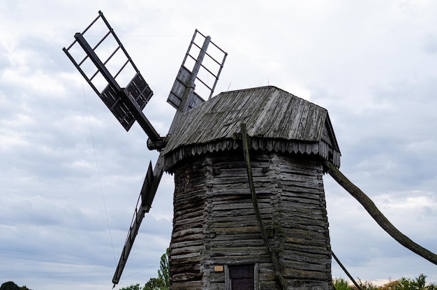 Summer landscape with an old wooden mill