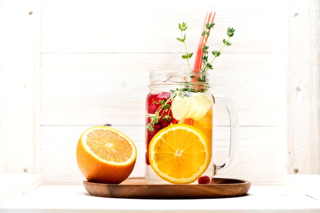 Summer lemonade with fruits and berries in a jar