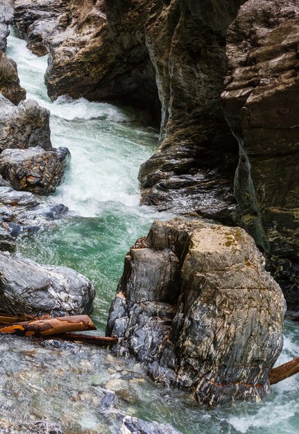 Summer Liechtensteinklamm gorge with stream and waterfalls in Austria.