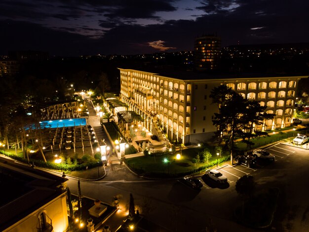 Summer luxurious resort, aerial view from above, night evening drone view of five star hotel and pool in Bulgaria